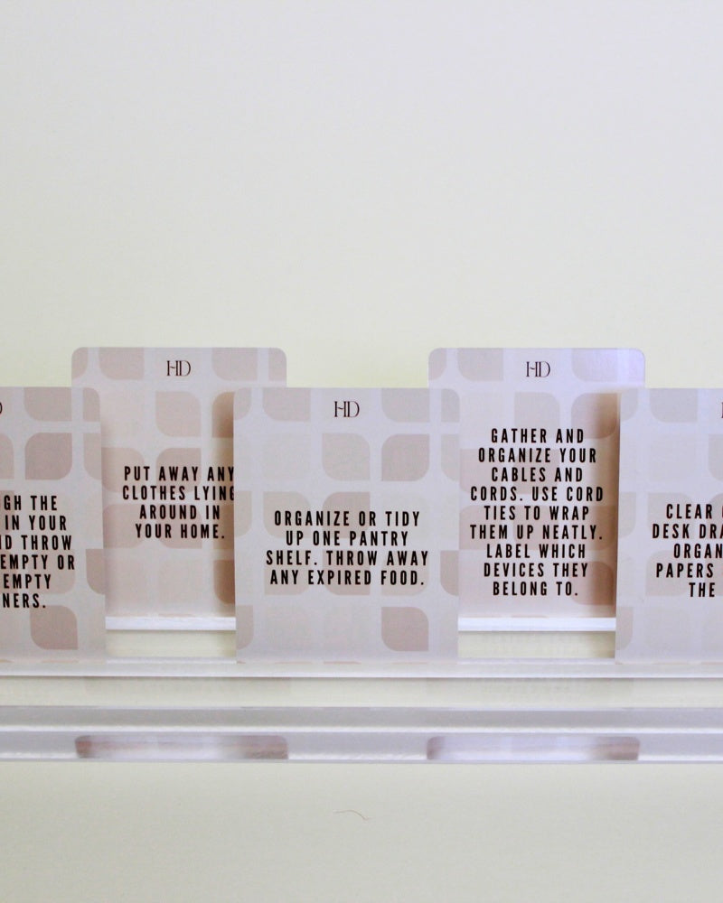 Set of Declutter Deck prompt cards with text instructions on a white surface
