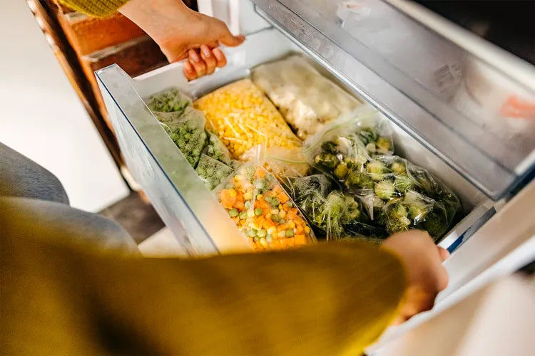 Allrecipes article featuring expert tips for organizing freezer drawers and the storage tools they recommend