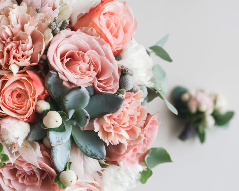 Bridal bouquet with roses and greenery wedding gift ideas for couples