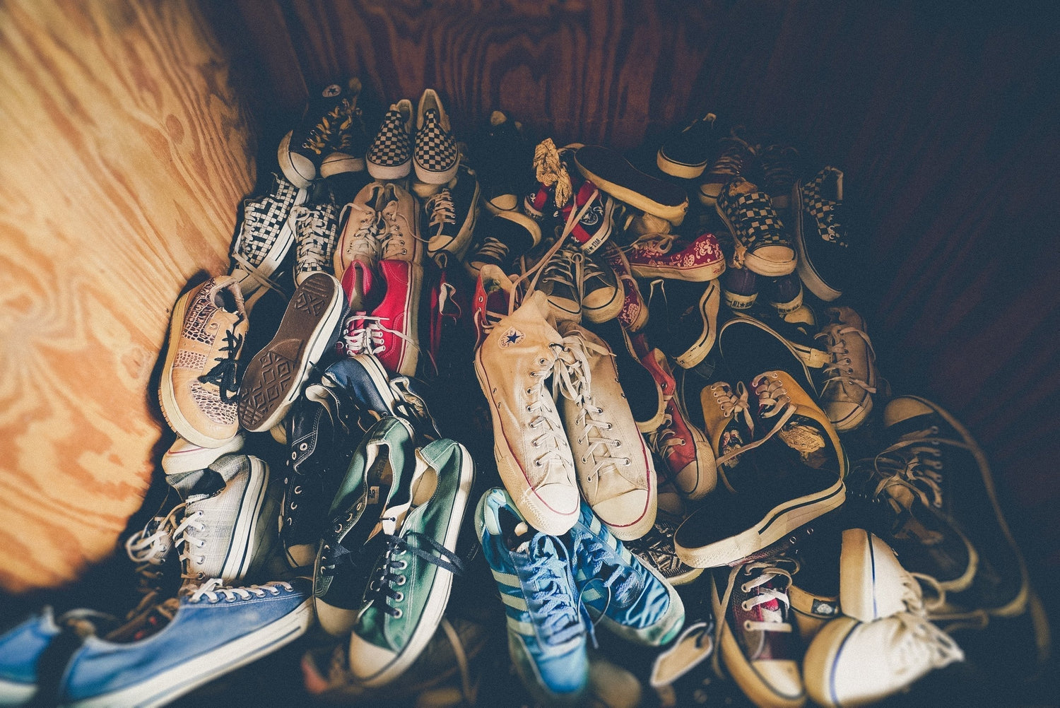 Close-up of shoes stored in cluttered space