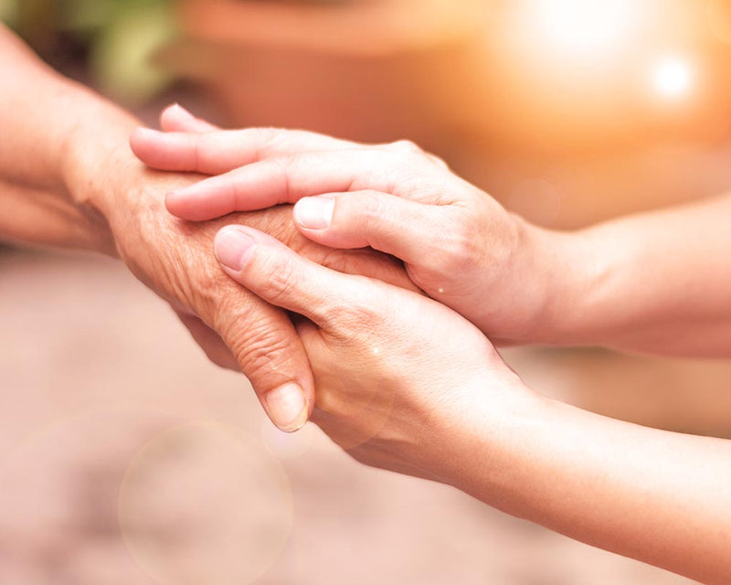 ways to show love Two people holding hands as a sign of love