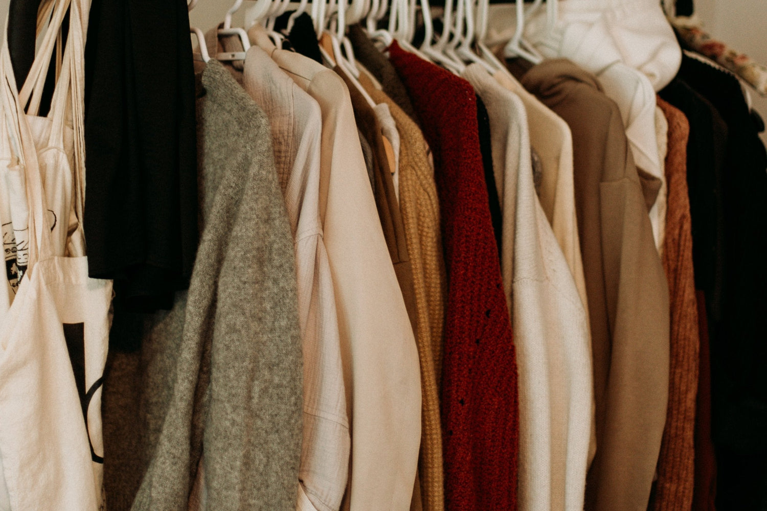 Clothes hanging neatly in closet