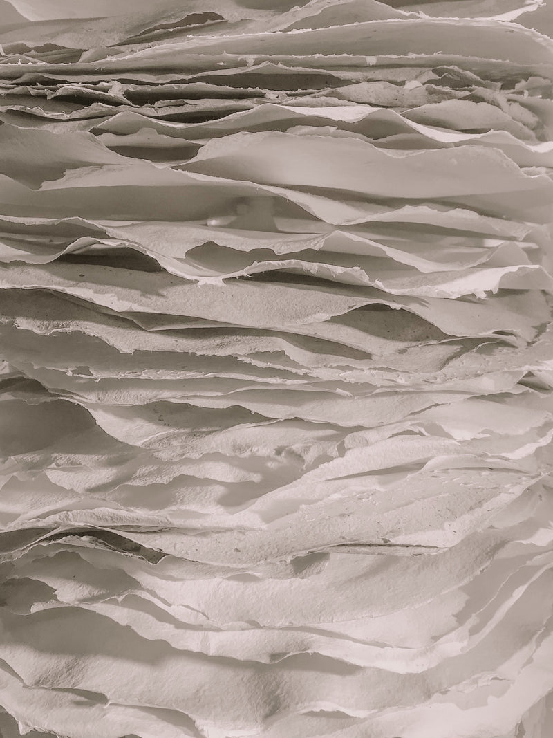 how to declutter paper Stacked white papers creating abstract texture