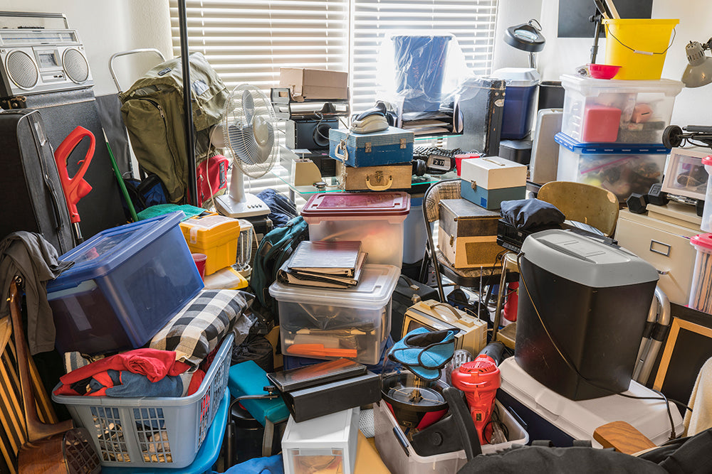 Cluttered room filled with boxes and items