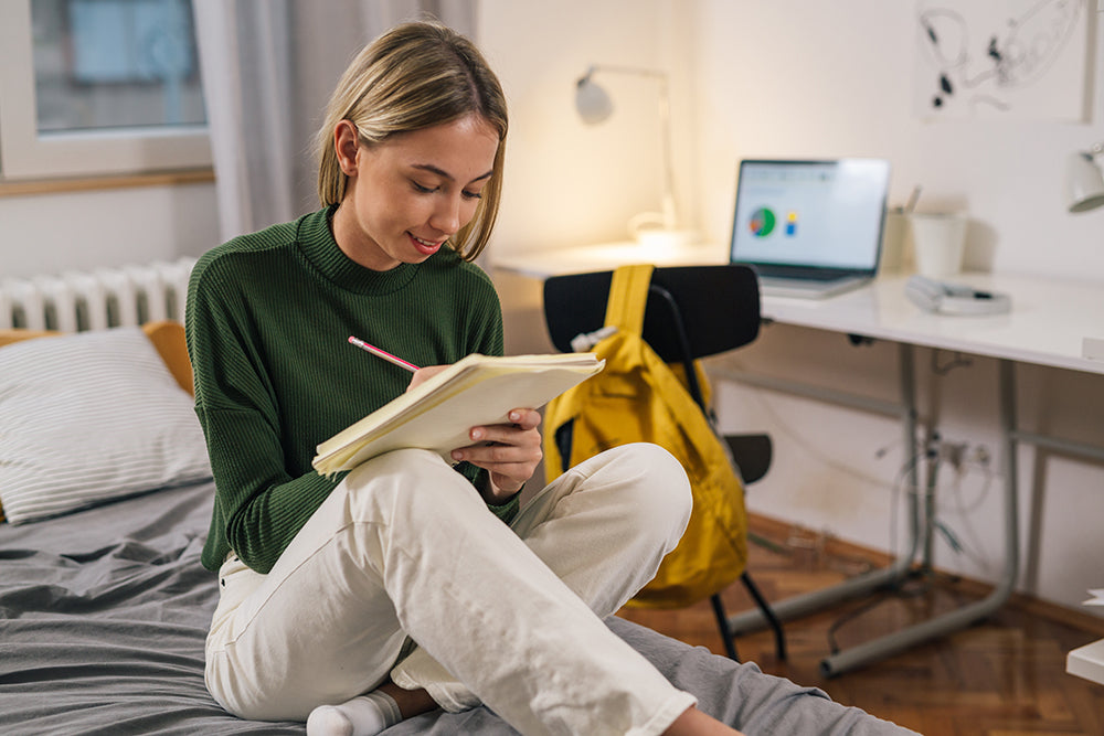 Woman reading book in cozy room dorm room organization