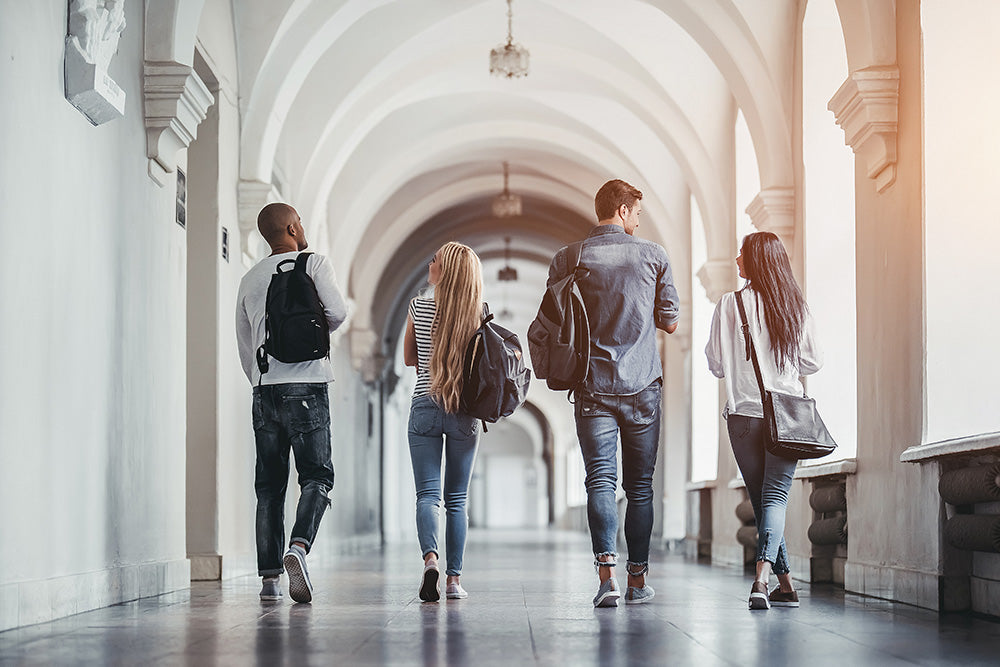 Students walking through a college hallway