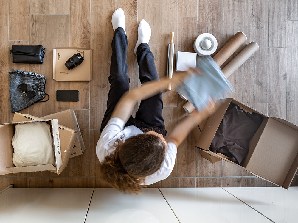 Person organizing items on a table