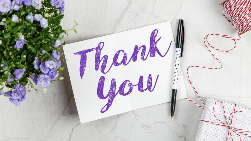 Handwritten thank you notes with flowers