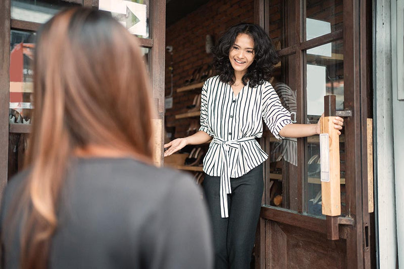 Woman smiling while giving presentation ripple effect of kindness