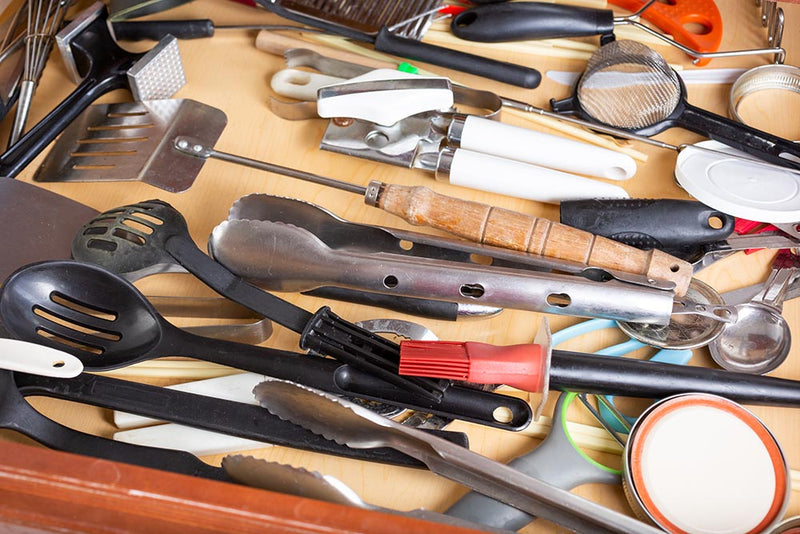 Close-up of tools in a junk drawer how to organize a junk drawer