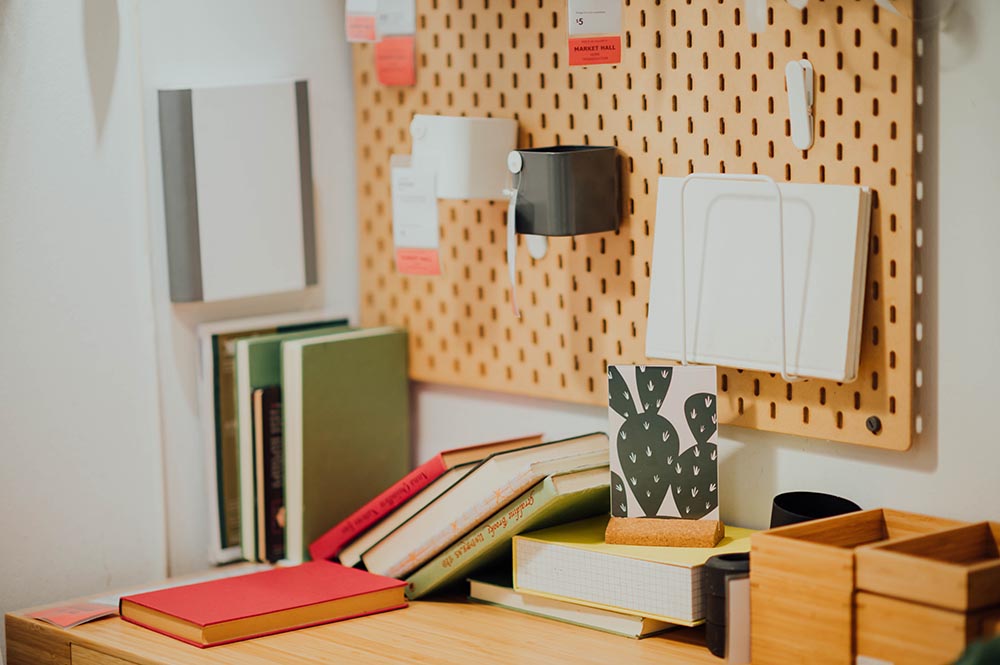Organized dorm room with books and plants