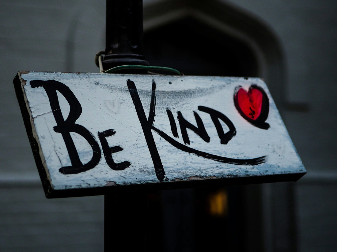 Be kind sign with heart on it