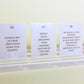 Three white Declutter Deck cards for decluttering and organizing with black text on a white surface