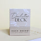 Box of Declutter Deck decluttering prompt cards by Hack Decks on a light background