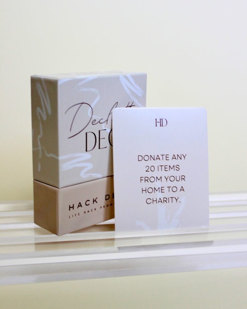 Product packaging of Declutter Deck with a card on a light surface