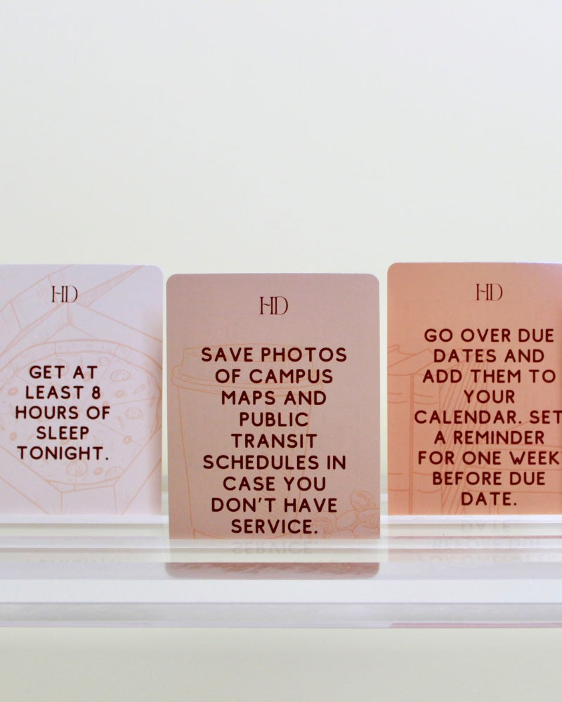 Three Dorm Deck cards with motivational text on a white surface