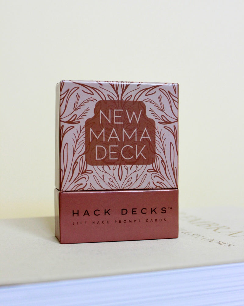 Pack of 'New Mama Deck' cards by Hack Decks on a light background