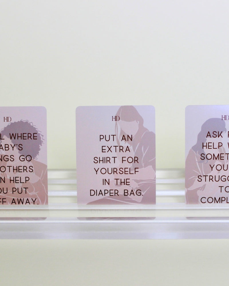 Three cards with advice for new mothers on a white background