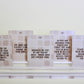 Set of five Ten Minute Tidying Tasks Declutter Deck prompt cards with text instructions on a white surface