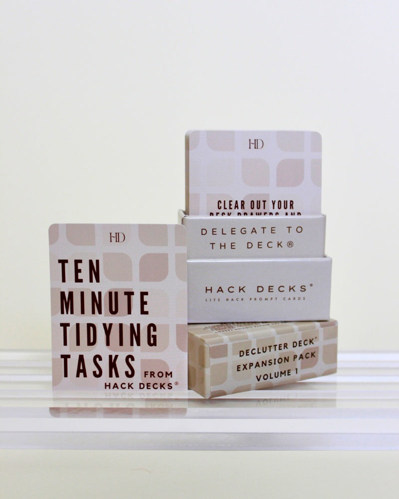 Stack of 'Hack Decks' productivity cards on a white surface with a light gray background